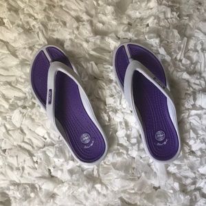 Never worn before purple flip flops